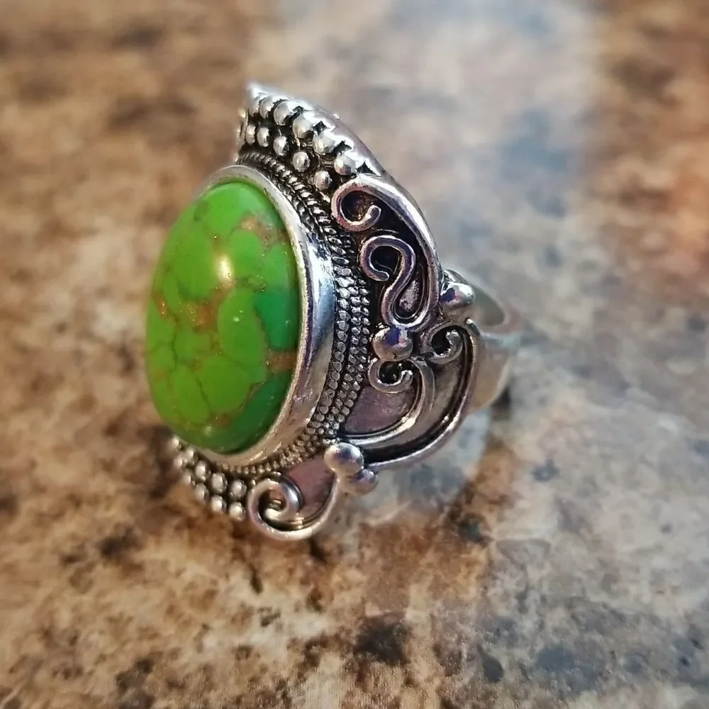 Inlaid turquoise egg shape carved ring size 8